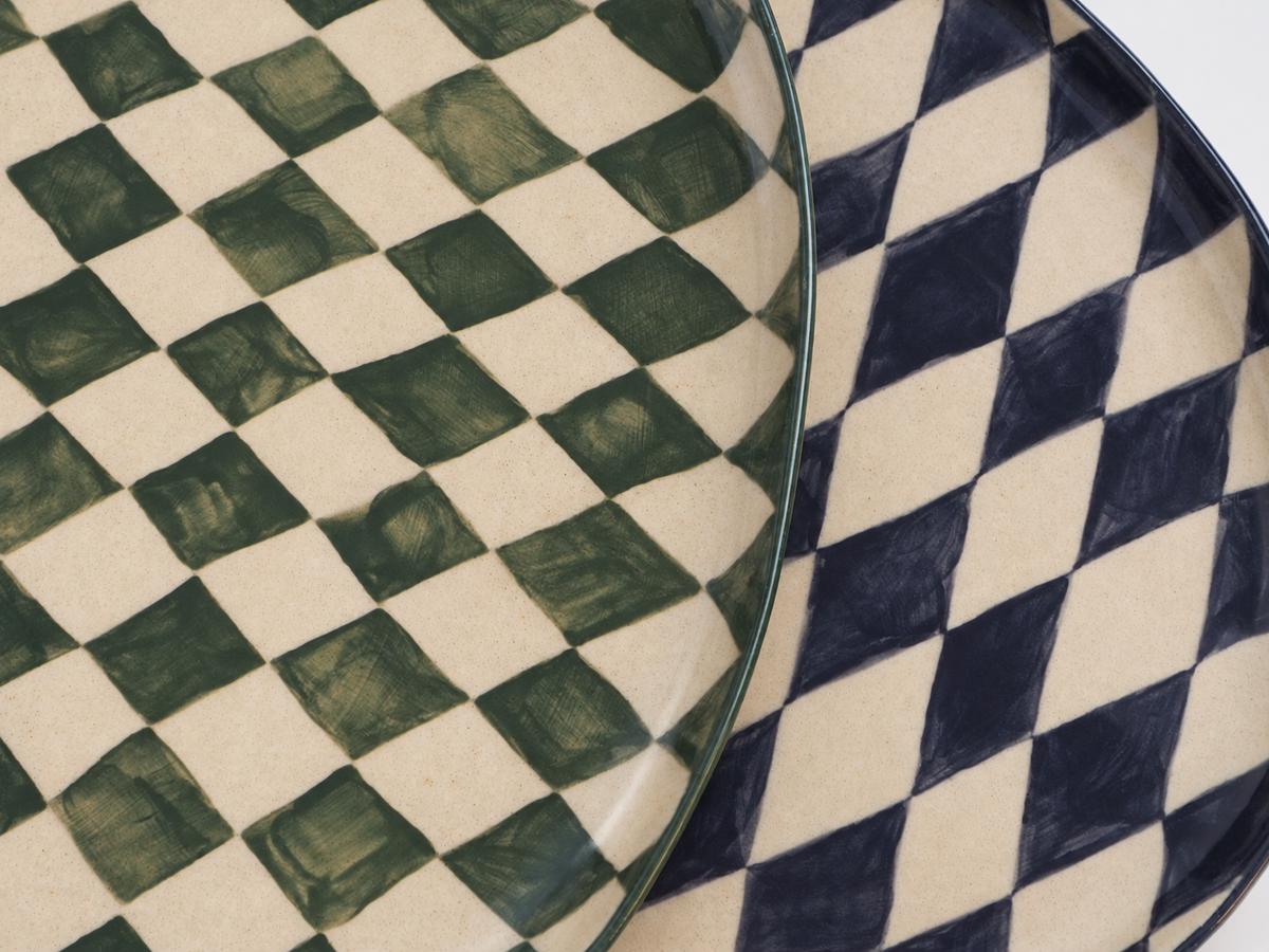 Close detail of blue and green geometric ceramic platters