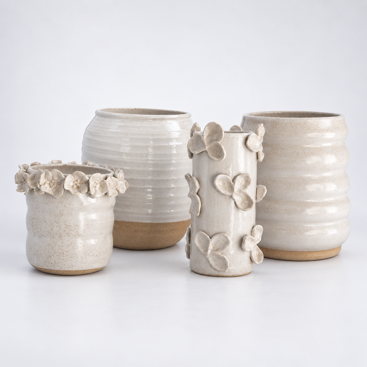 Ivory ceramic vase set with floral and ribbed details